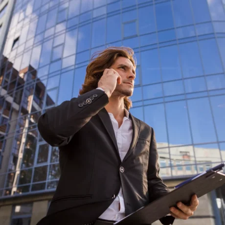elegant man talking phone low angle shot 23 2148230183